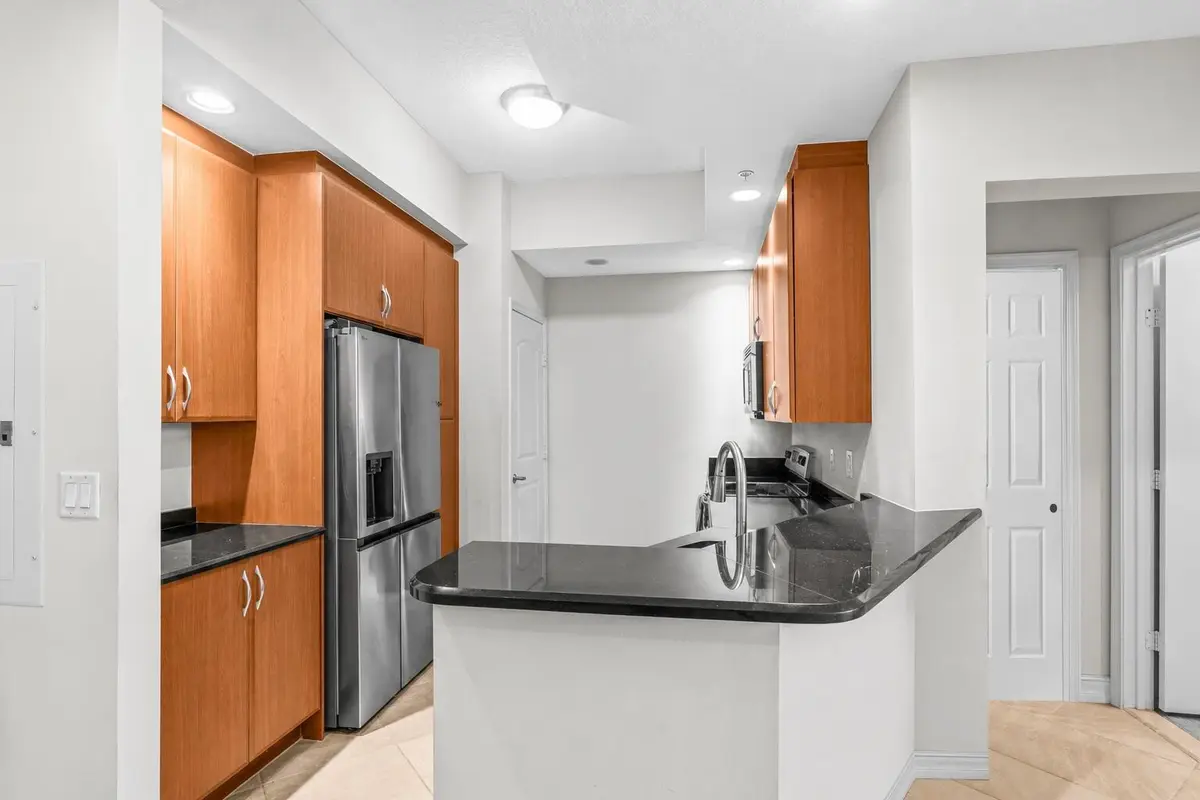 Kitchen with Eat-In Bar at 701 S Olive Avenue 1213, West Palm Beach