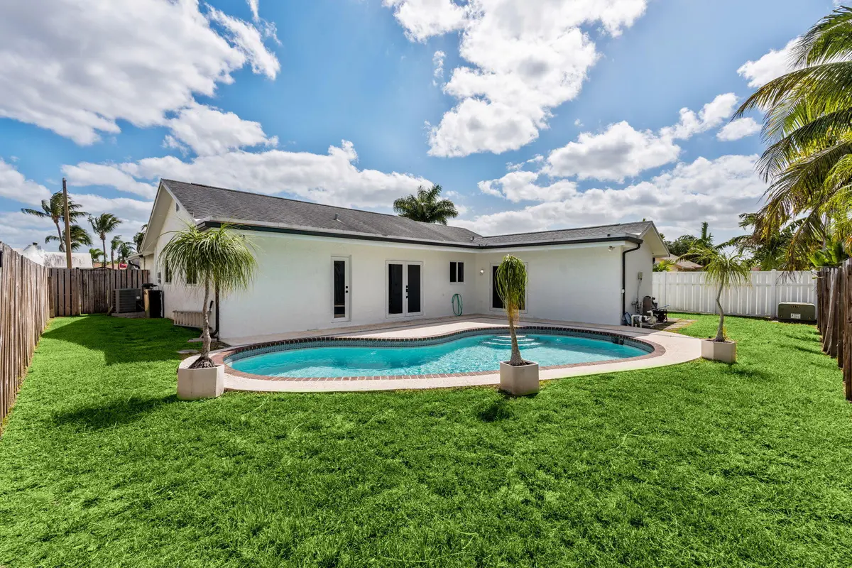 Back of House with Pool at 11831 NW 38th Place, Sunrise