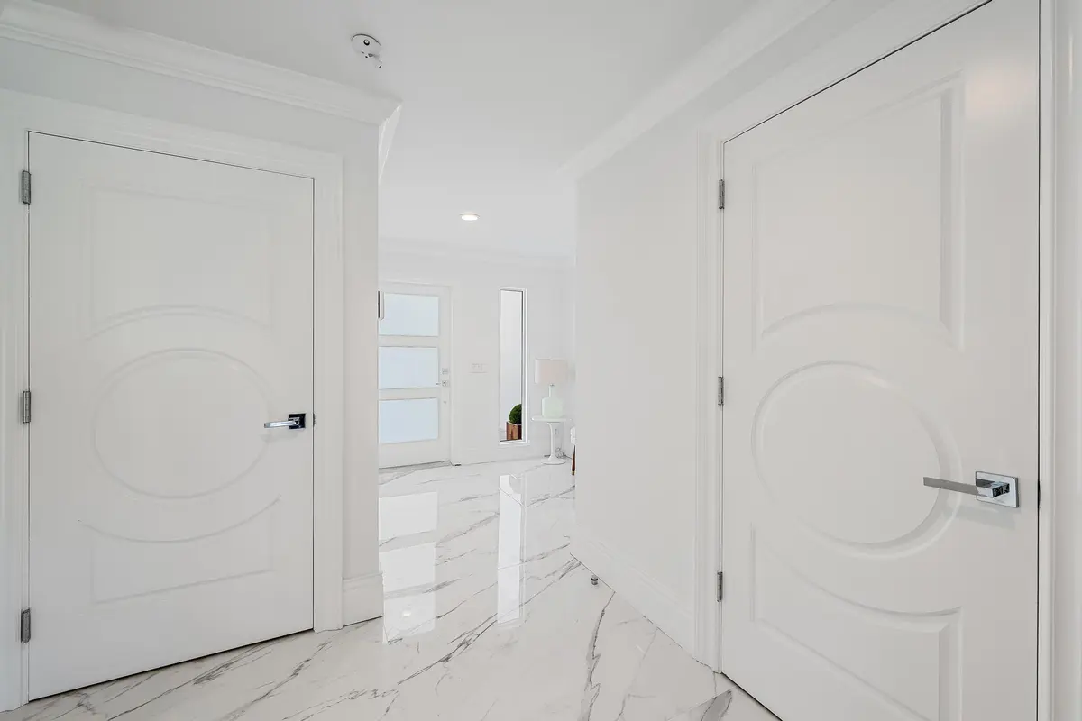 ENTRANCE W/ CUSTOM DOORS at 2435 Presidential Way H, West Palm Beach