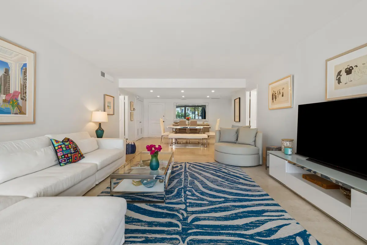 living room into dining room at 2295 S Ocean Boulevard 302, Palm Beach