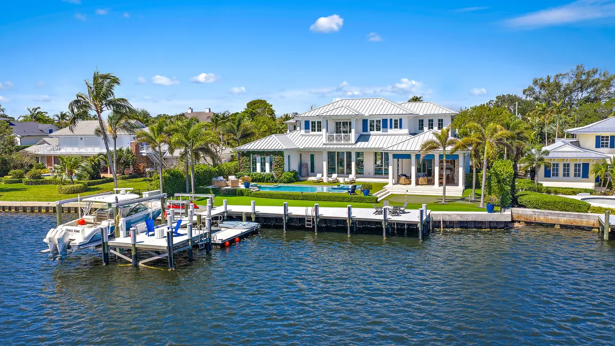 Rear Exterior at 11730 Lake Shore Place, North Palm Beach