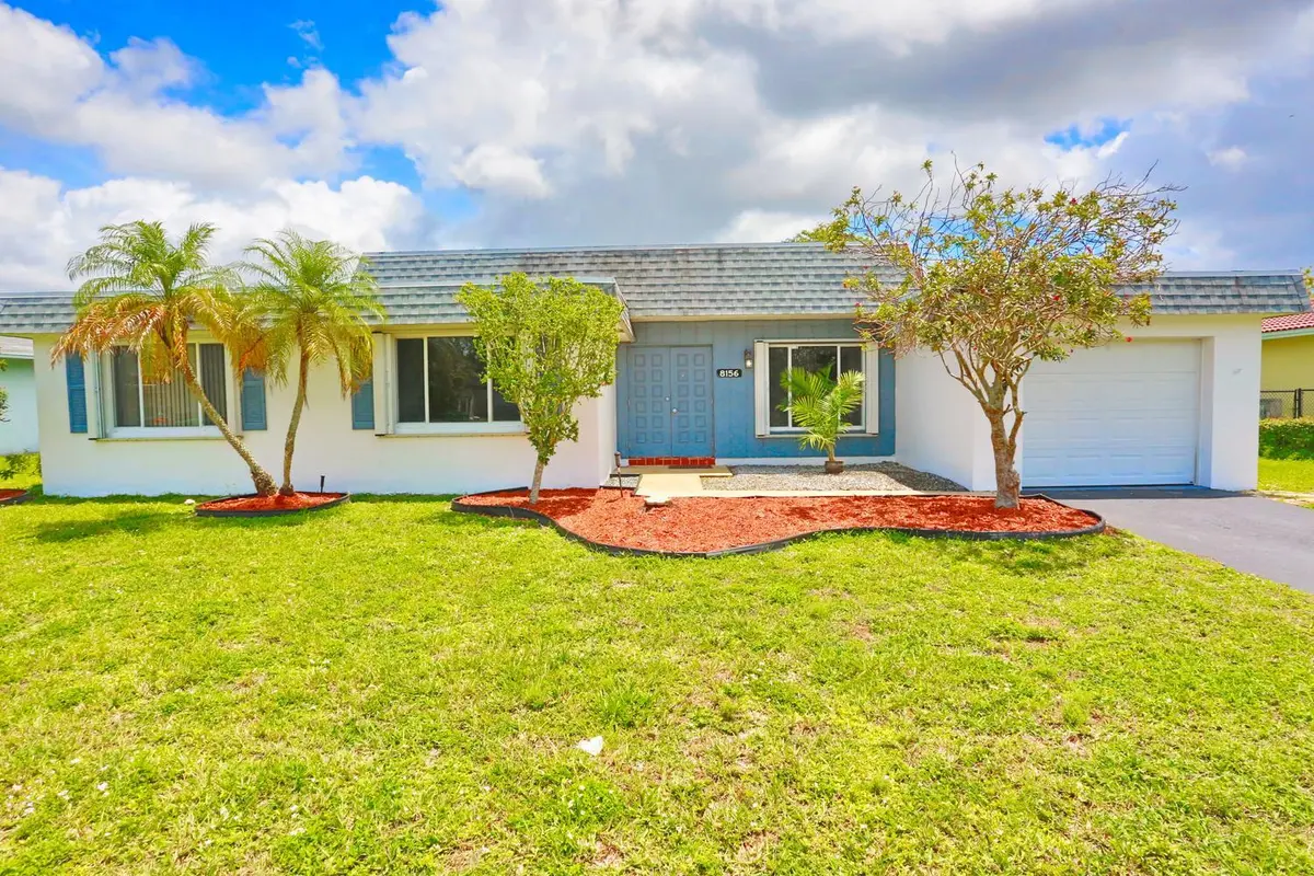 001-007-Exterior Front-1500x1000 at 8156 NW 67th Avenue, Tamarac