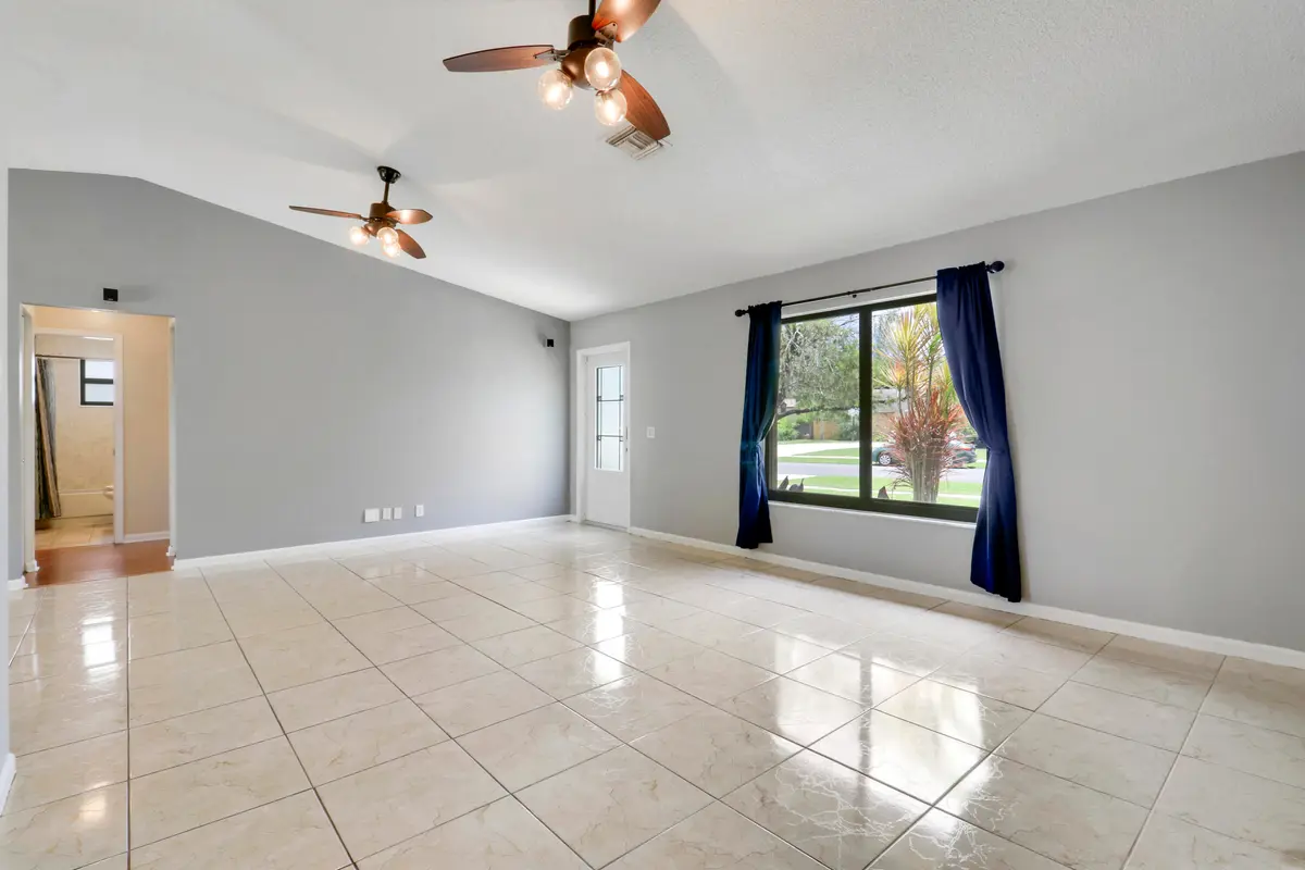 Living Room with Vaulted Ceilings at 144 Bilbao Street, Royal Palm Beach