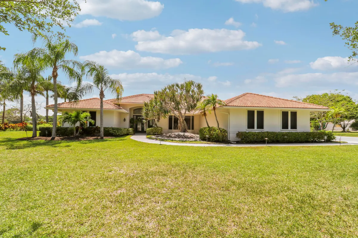 front exterior at 8667 Steeplechase Drive, Palm Beach Gardens