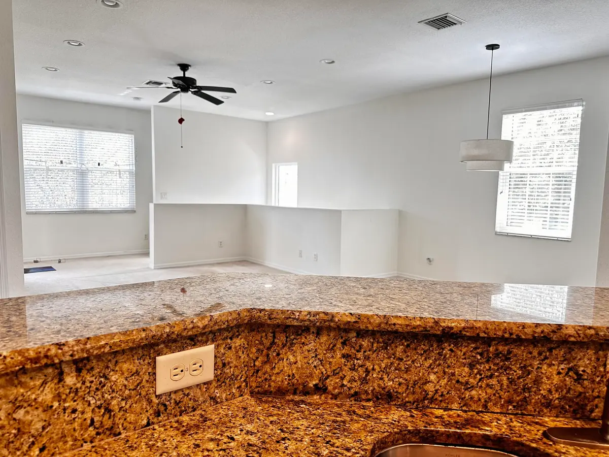 Kitchen to LR at 3031 SE Lexington Lakes Drive 204, Stuart