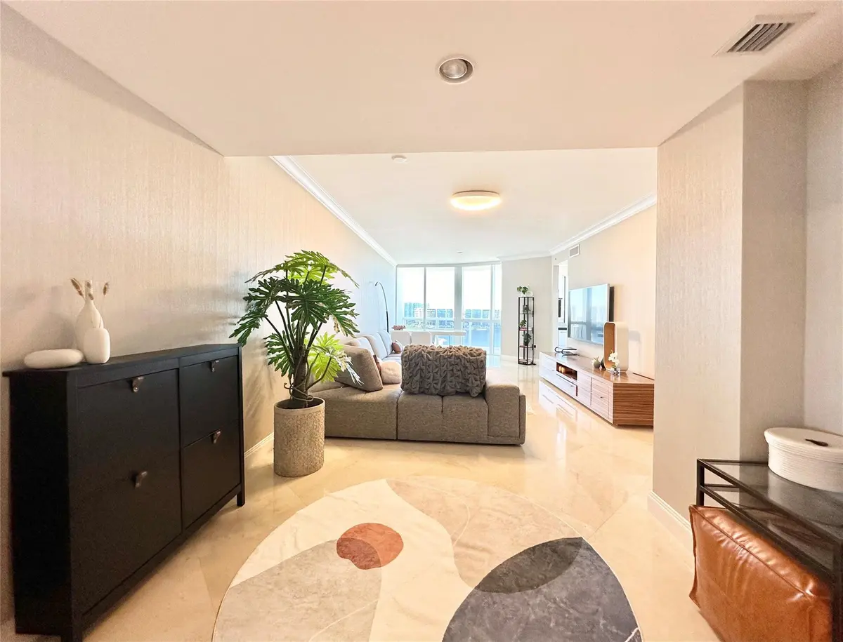 Full view of living room from entry area at 18201 Collins Avenue 1901, Sunny Isles Beach