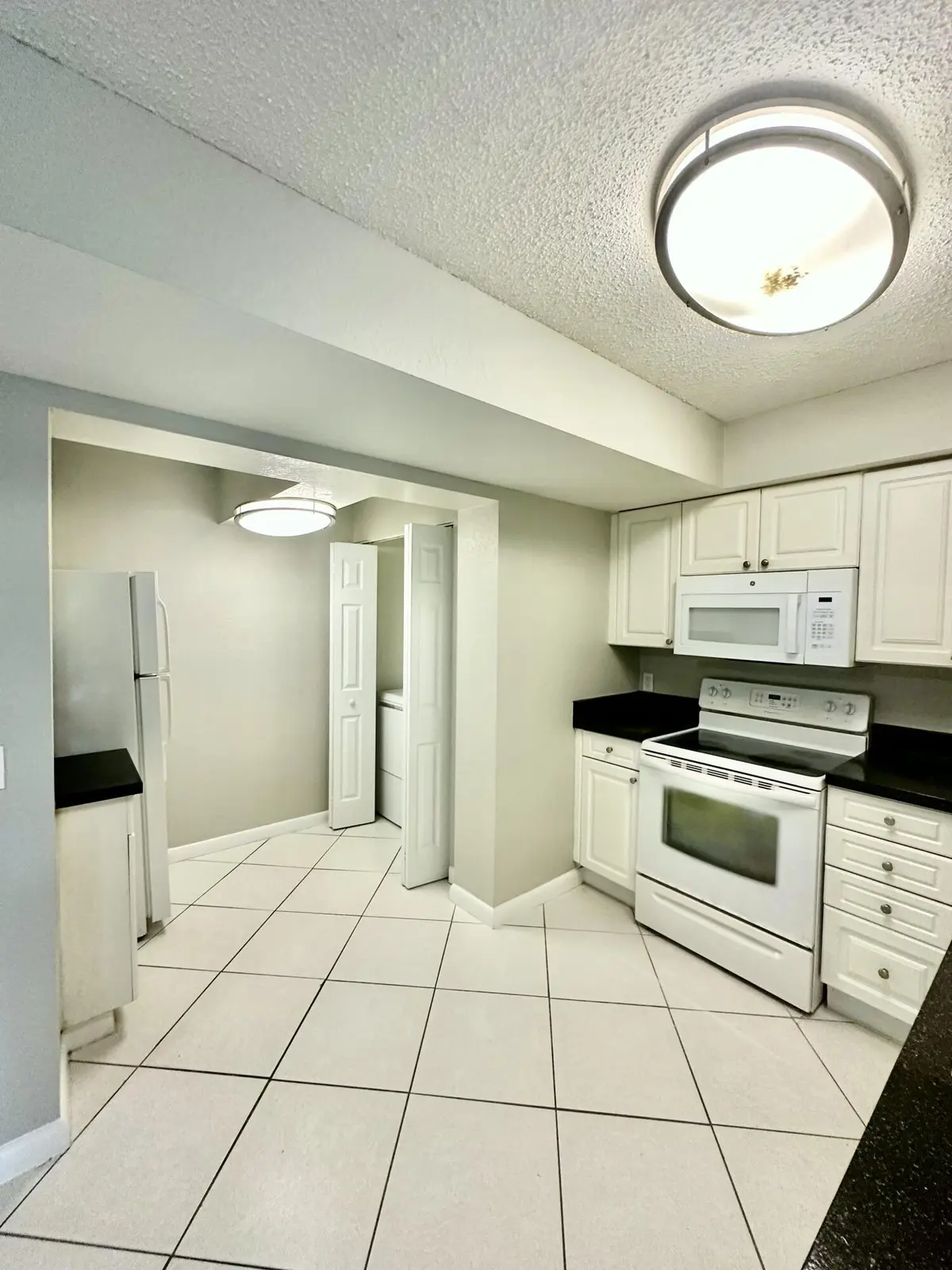 Kitchen / Laundry at 4120 Union Square Boulevard C1, Palm Beach Gardens