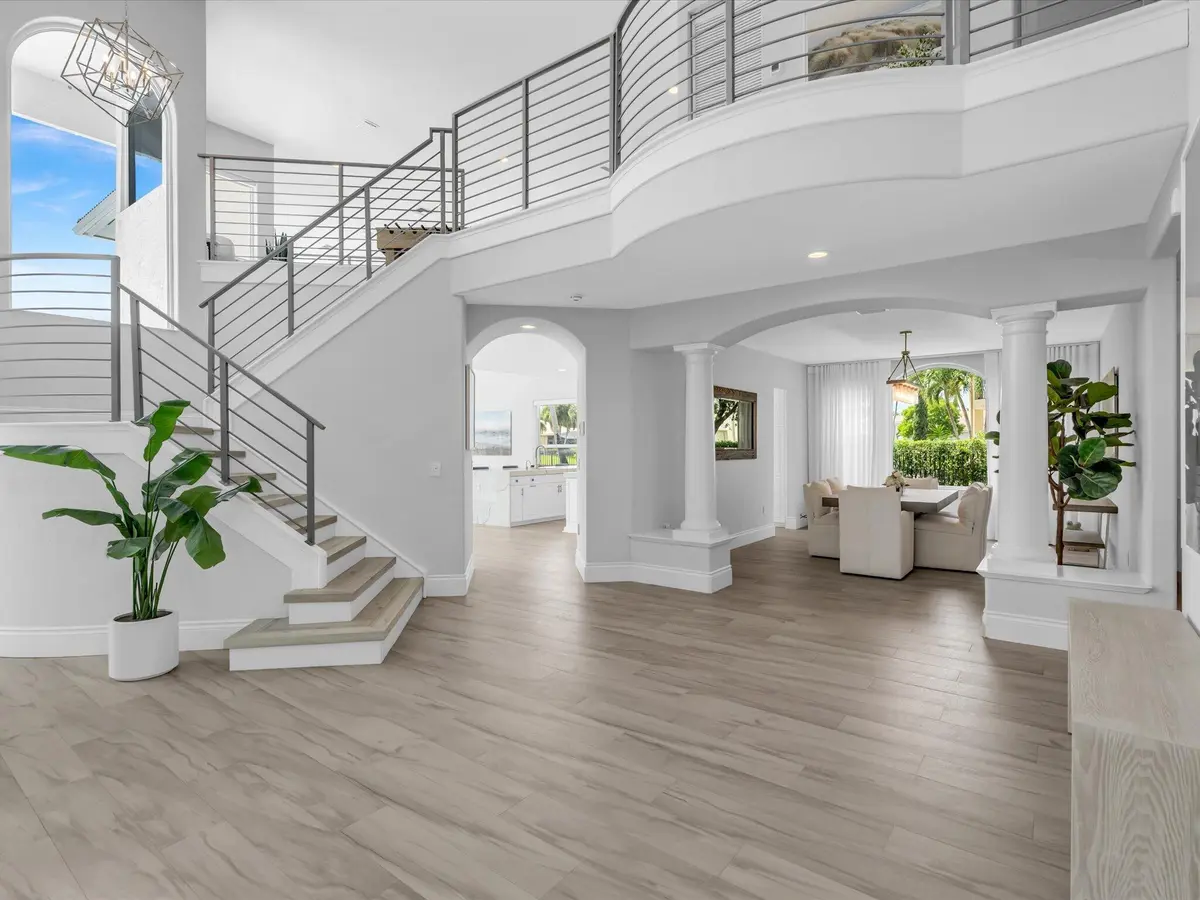 Foyer to Dining Room - Staircase at 15783 Viana Winds Point, Delray Beach