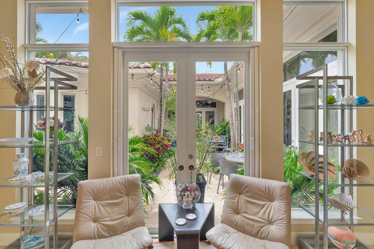 FRONT FOYER WITH COURTYARD VIEW at 11316 Caladium Lane, Palm Beach Gardens