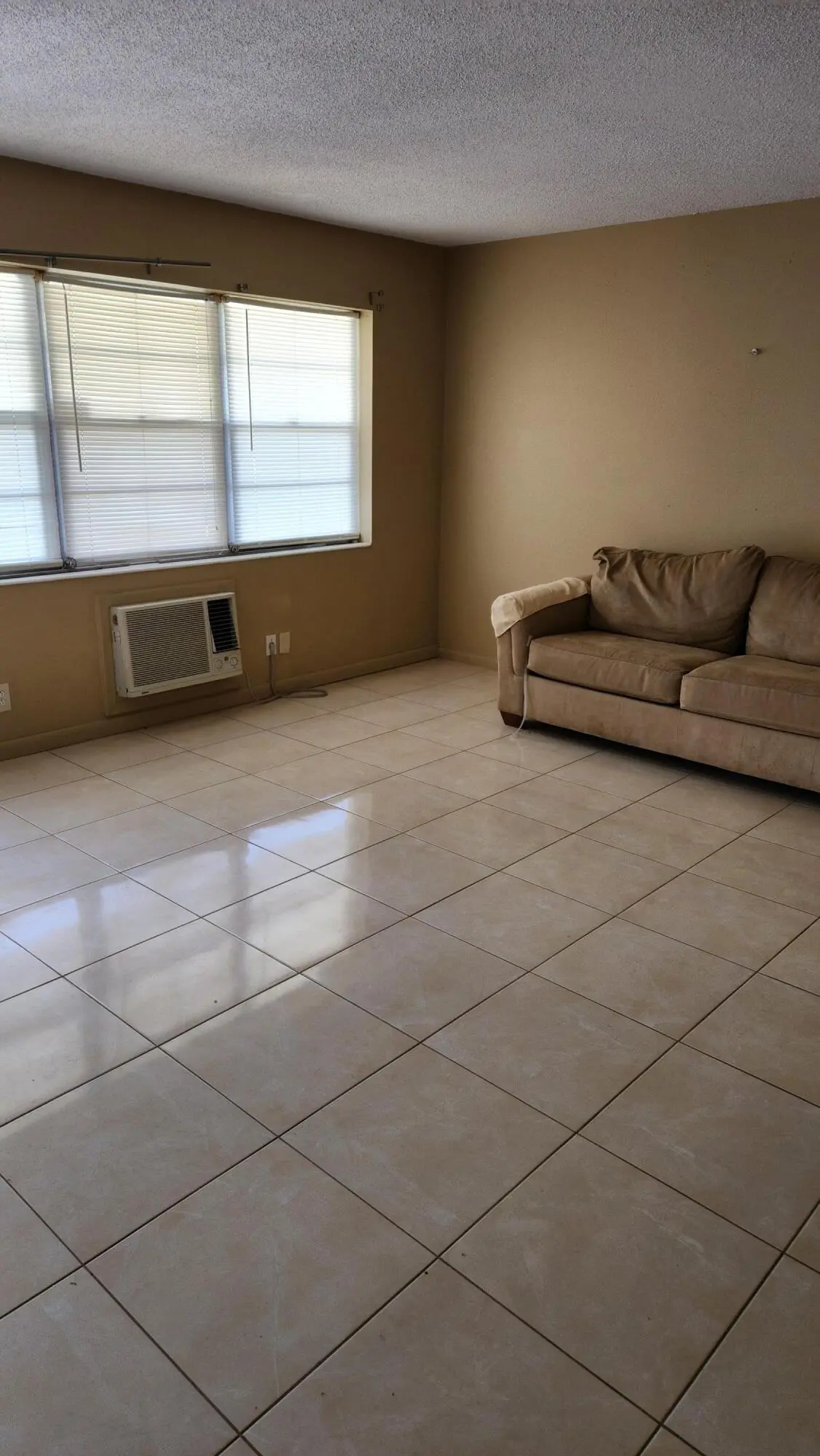 Bright Living room and AC unit at 102 Andover D, West Palm Beach