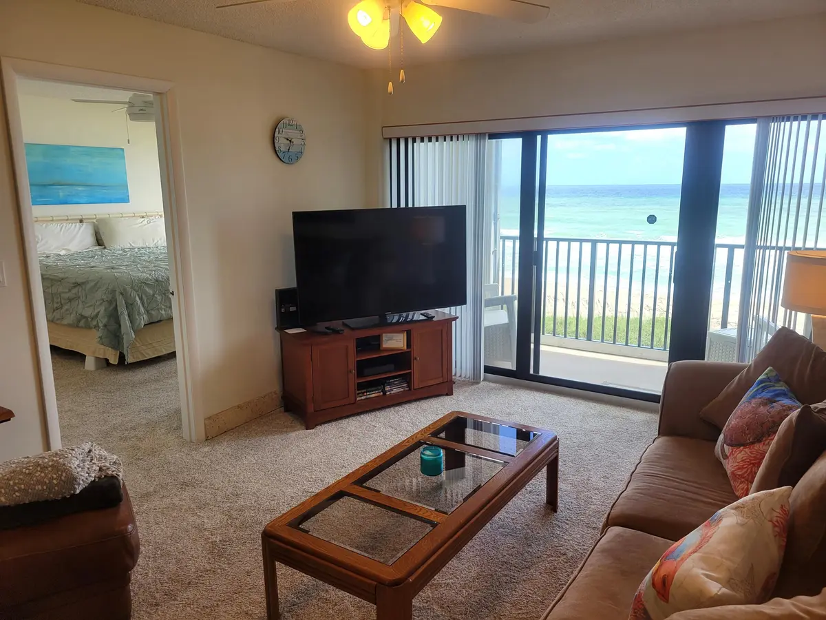 Living Room and Primary Bedroom at 10152 S Ocean Drive 418b, Jensen Beach
