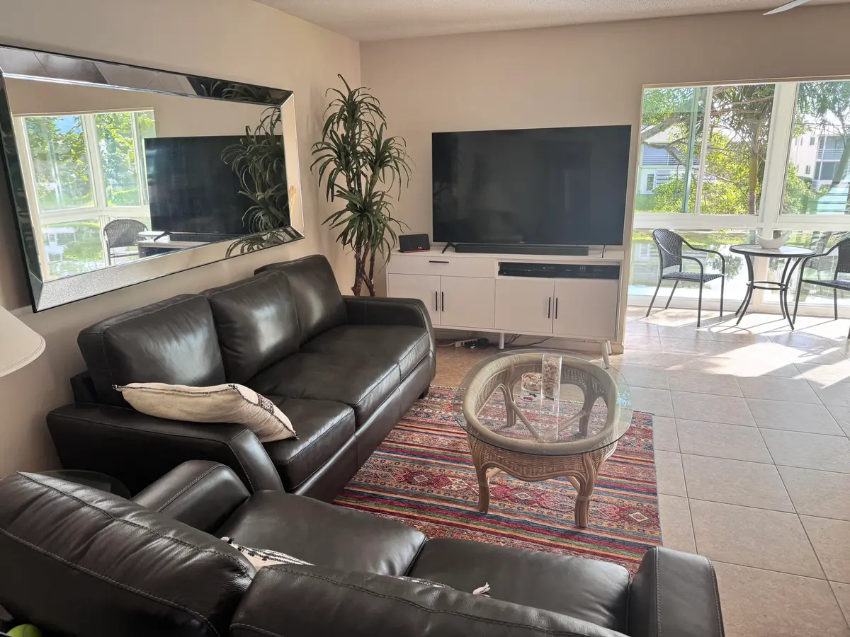 living room and lanai at 209 Oxford 100 209, West Palm Beach