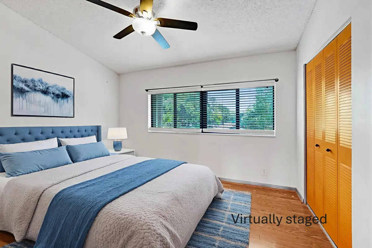 Virtual Staging 4 guest bed wm at 3080 S Oakland Forest Drive 101, Oakland Park