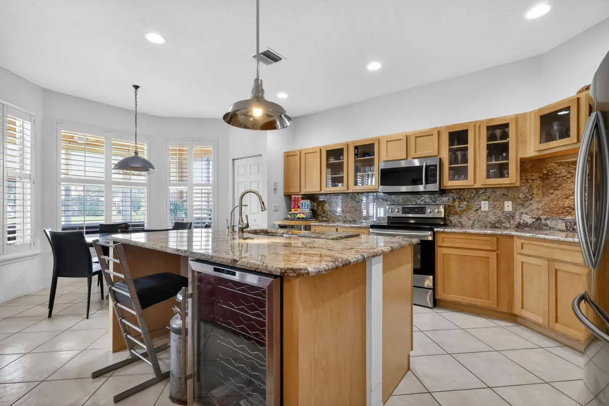Open Kitchen to Den at 12530 Vía Valenza, Boynton Beach