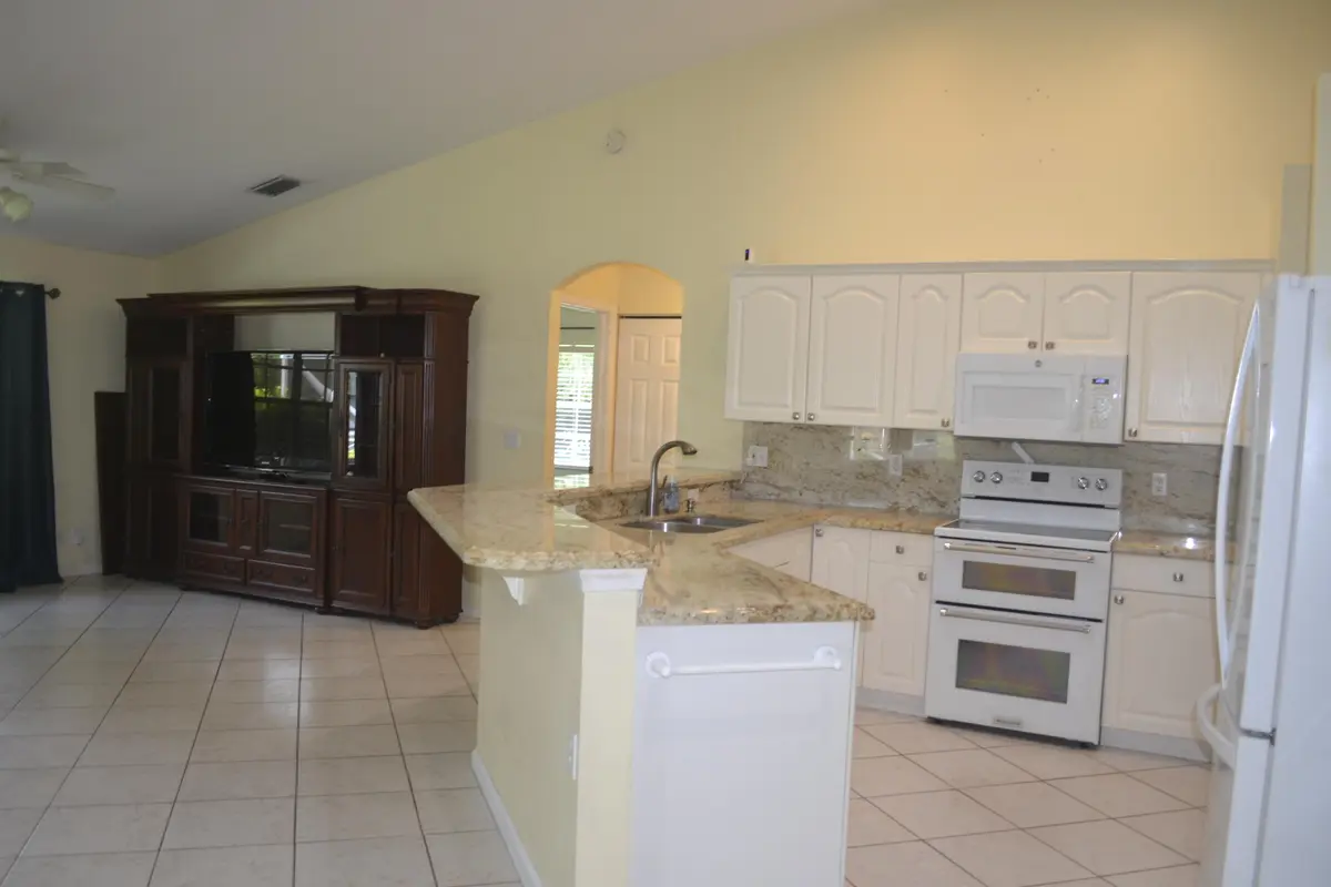 Kitchen open Family rm at 1104 Raintree Lane, Wellington