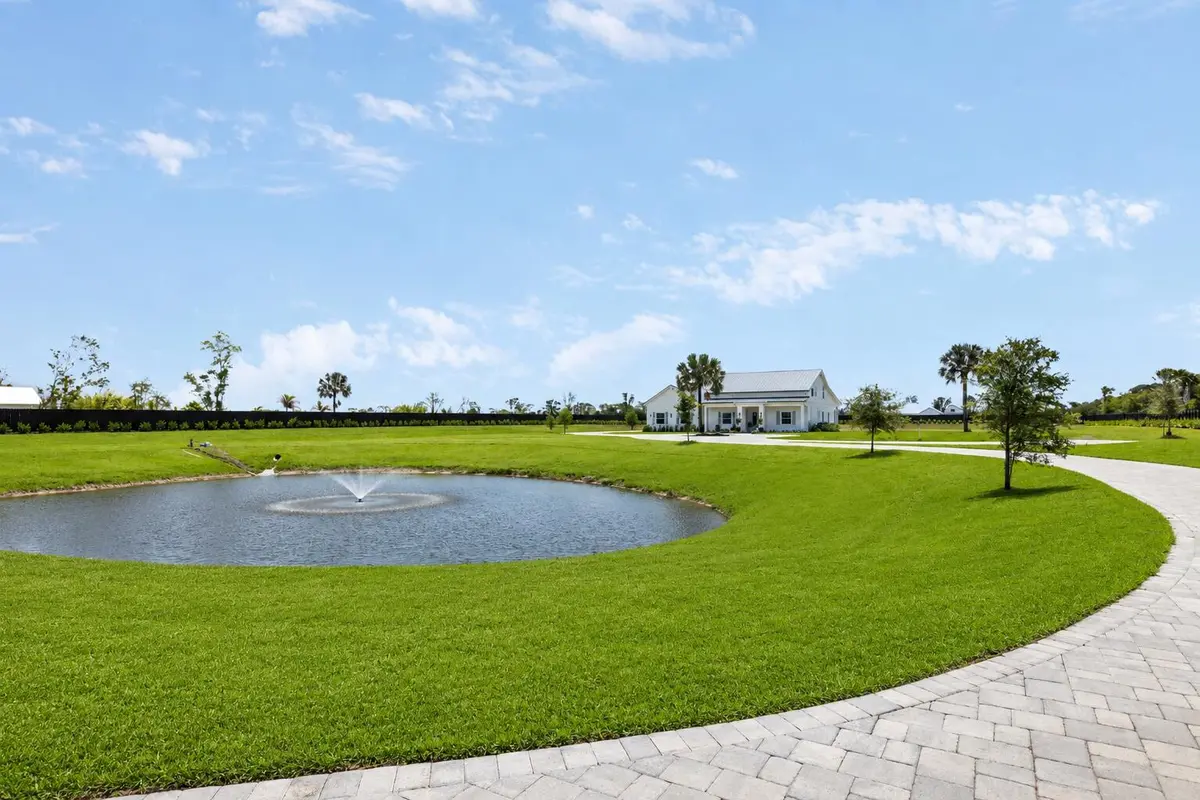 Front and pond at 4836 SW Savage Street, Palm City