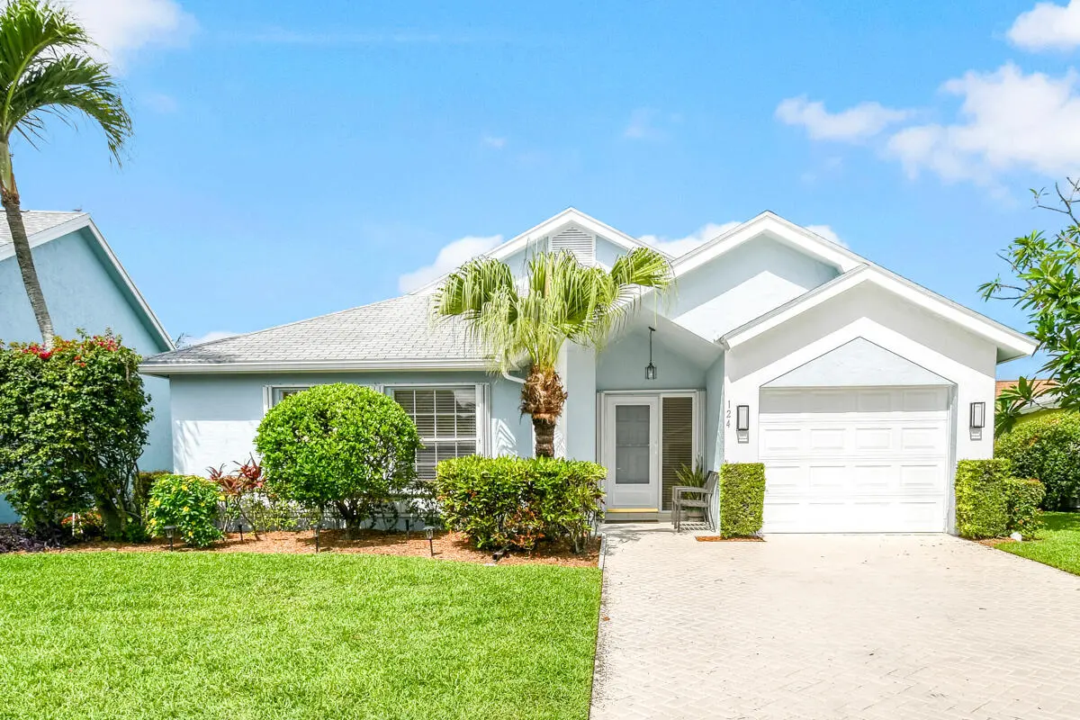 front of home at 124 Adobe Circle, Jupiter