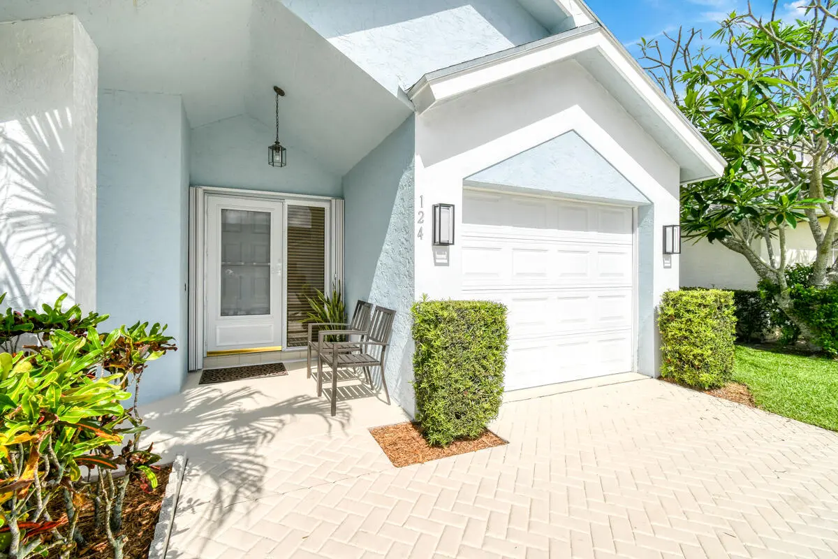 front of home at 124 Adobe Circle, Jupiter