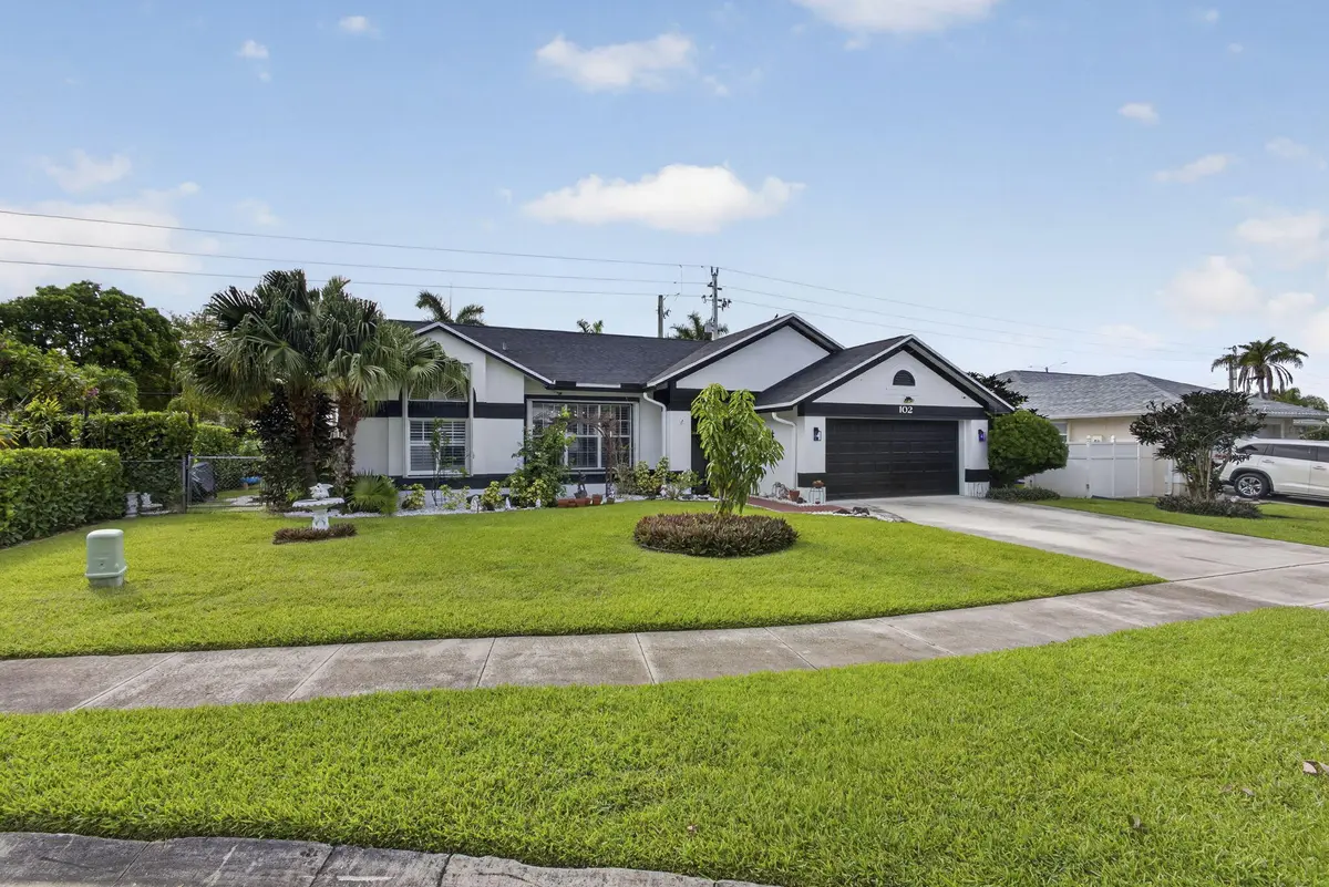 102 Royal Palm Cir Front 1 Exp at 102 E Royal Pine Cir, Royal Palm Beach