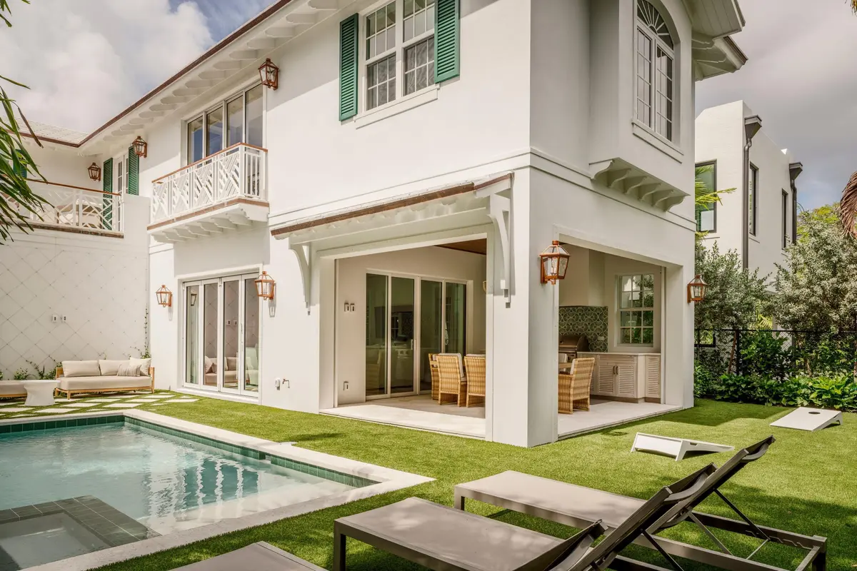04 - White home exterior with covered pa at 309 Greymon Drive, West Palm Beach