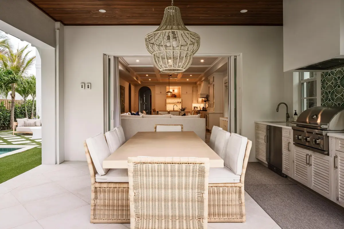 08 - Covered outdoor dining area with wi at 309 Greymon Drive, West Palm Beach