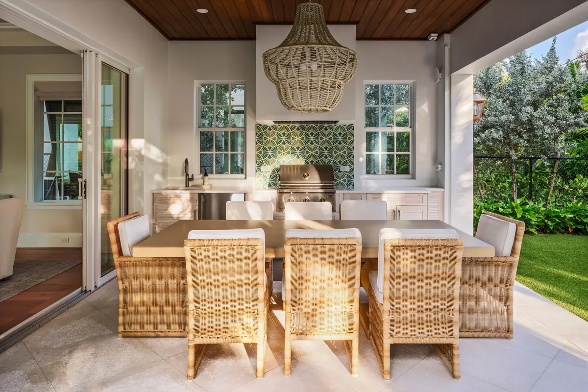 09 - Outdoor dining space with wicker ch at 309 Greymon Drive, West Palm Beach