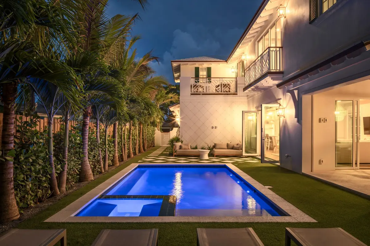 11 - Blue-lit pool with integrated spa a at 309 Greymon Drive, West Palm Beach