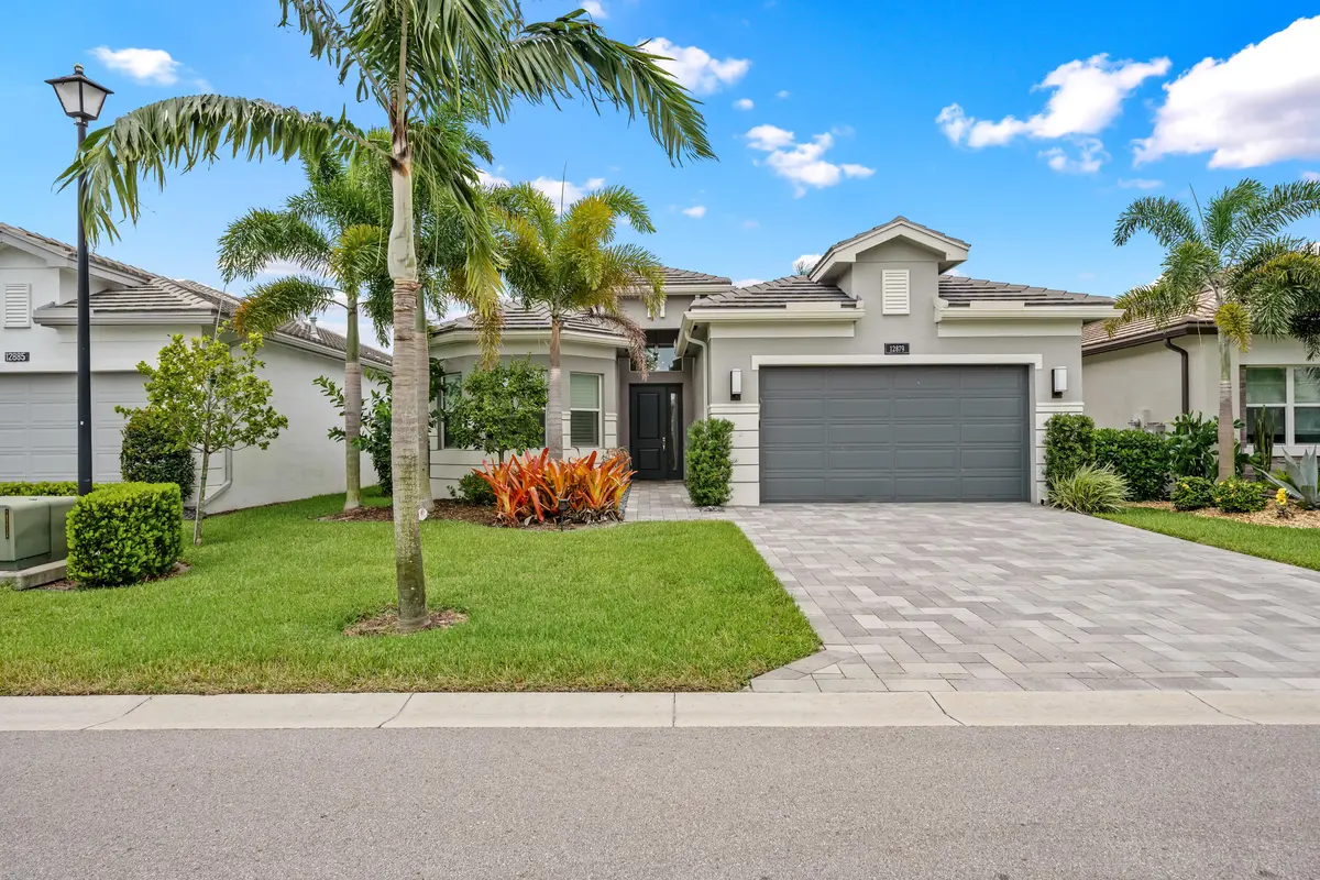 Stunning front elevation at 12879 Parrot Pond Road, Boynton Beach