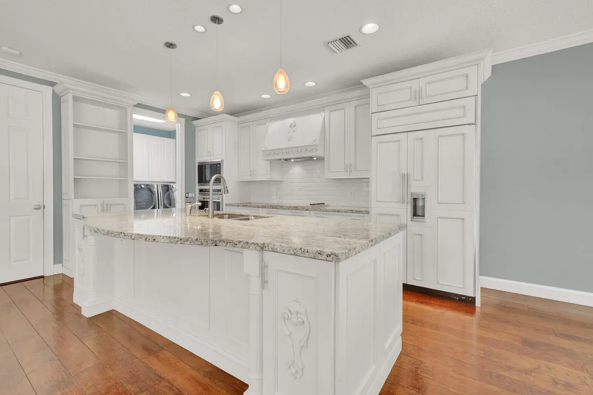 kitchen to laundry 221 at 221 Marlberry Circle, Jupiter