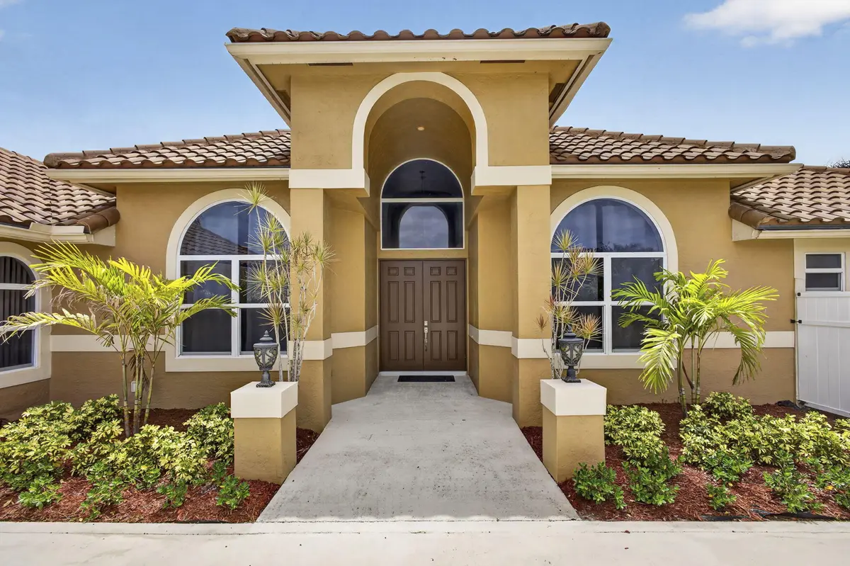 Front of House at 8030 Woodsmuir Drive, Palm Beach Gardens