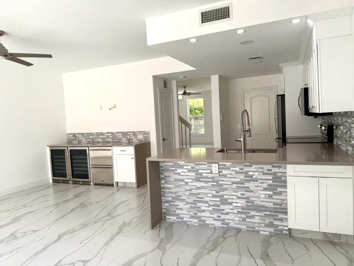 Kitchen island and bar at 117 Waterford Drive, Jupiter