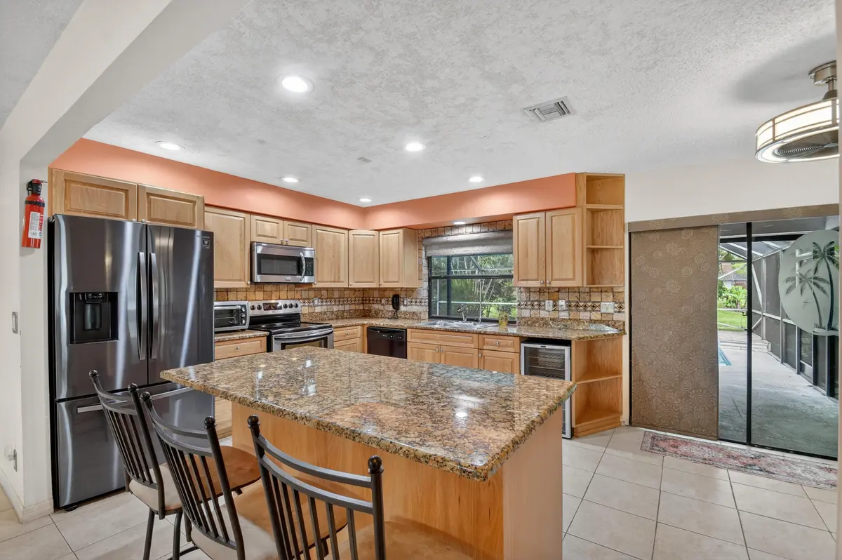 Kitchen with movable Island at 13606 Columbine Avenue, Wellington