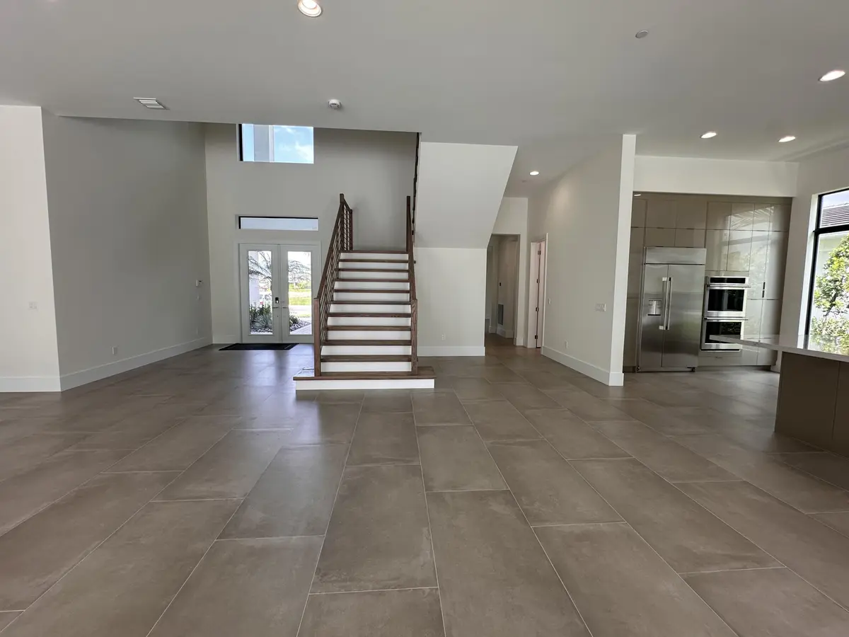 Lot 5 Entry Stairs and Kitchen at 9116 Coral Isles Circle {lot #05}, Palm Beach Gardens