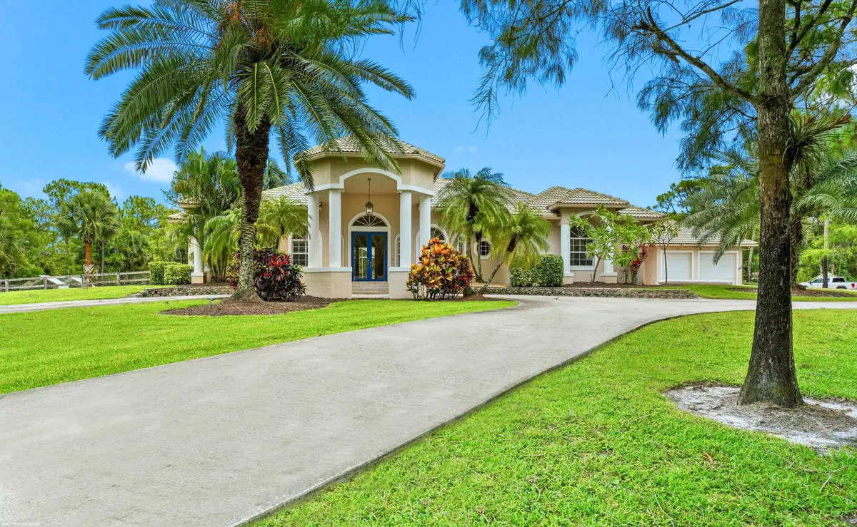 Front Elevation of the main residence at 2560 Buck Ridge Trail, Loxahatchee