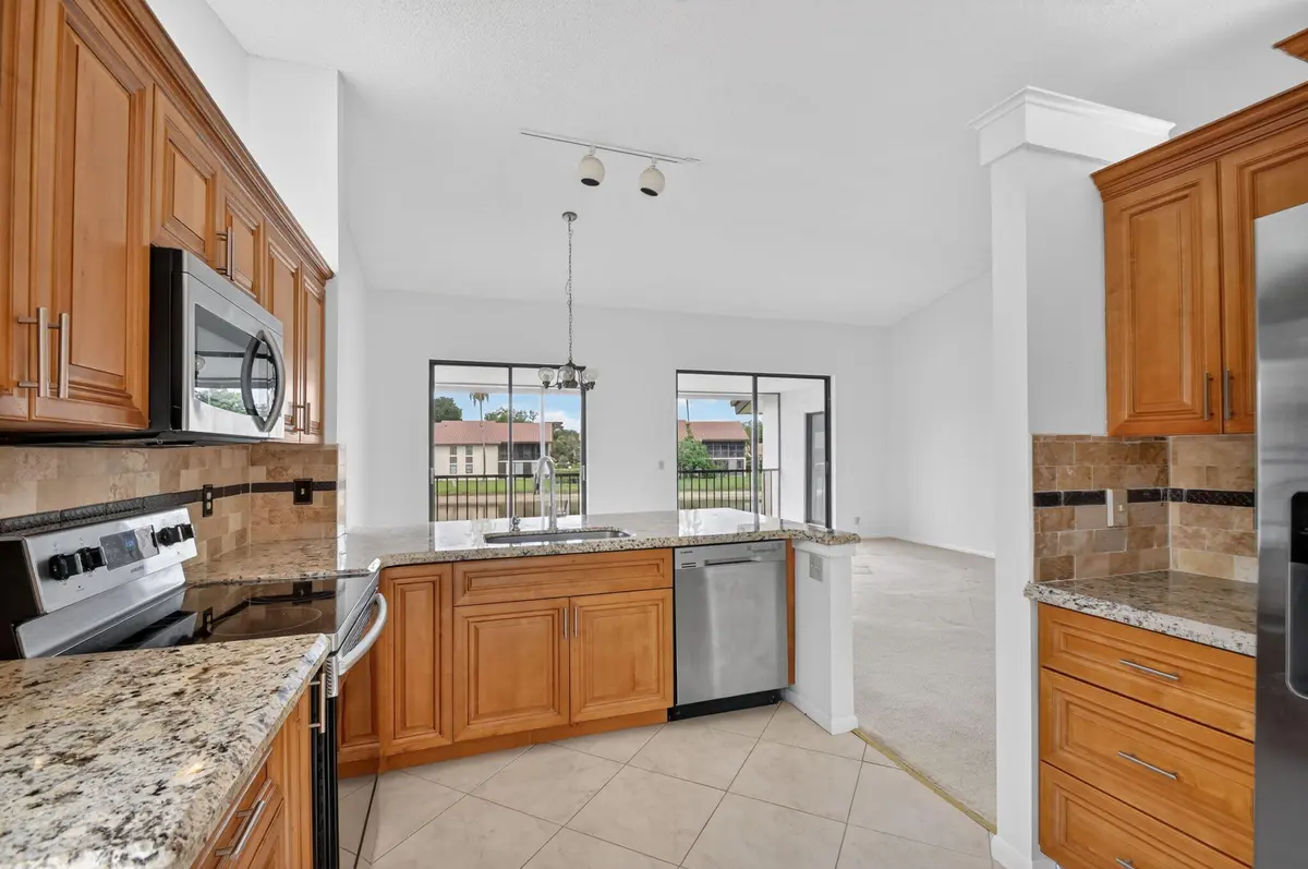 kitchen to living at 10231 N Circle Lake Drive 201, Boynton Beach