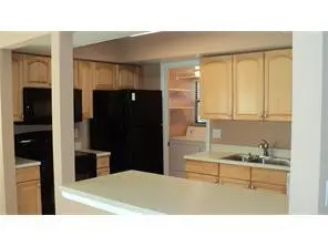 Kitchen view from dining room at 7200 NW 2nd Avenue 146, Boca Raton