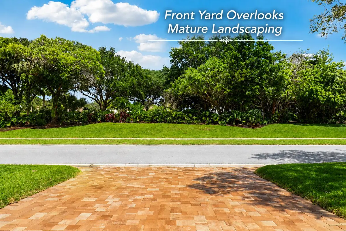 Front Yard Overlooks Mature Landscaping at 154 Sandbar Drive, Jupiter