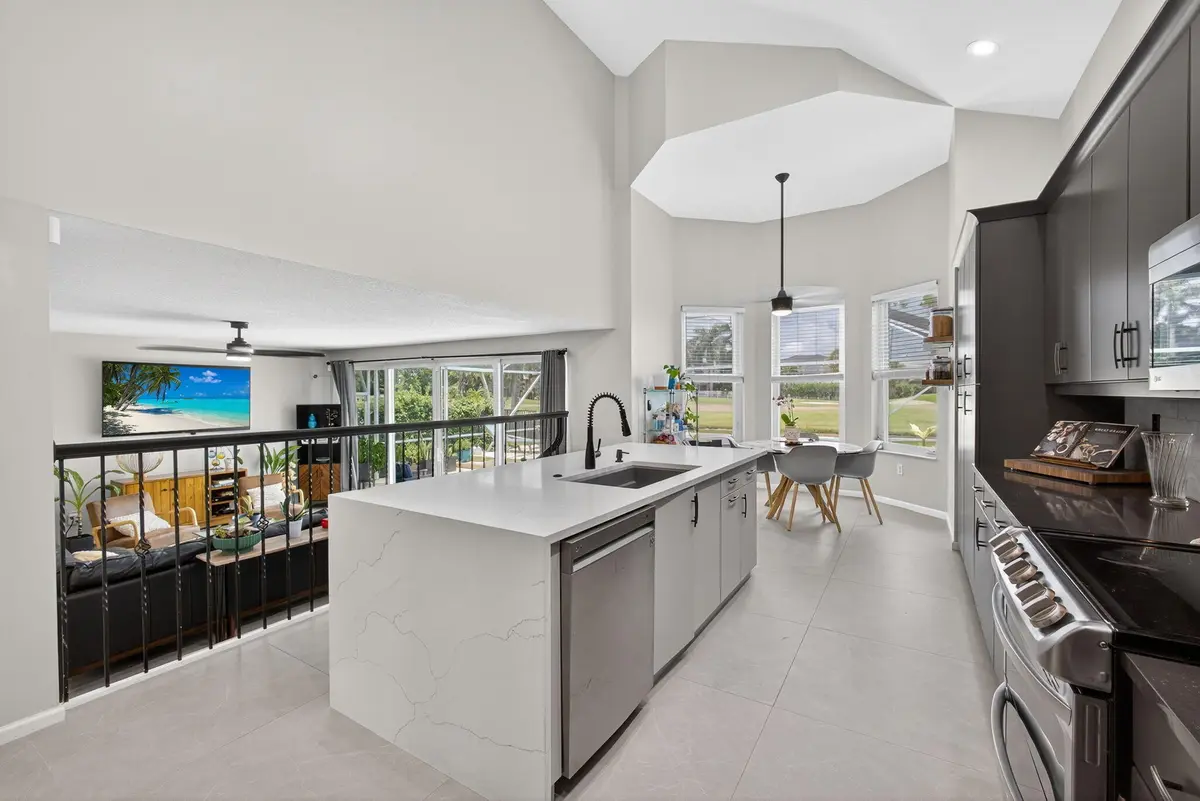 Kitchen overlooking Family and Pool at 2035 Reston Circle, Royal Palm Beach