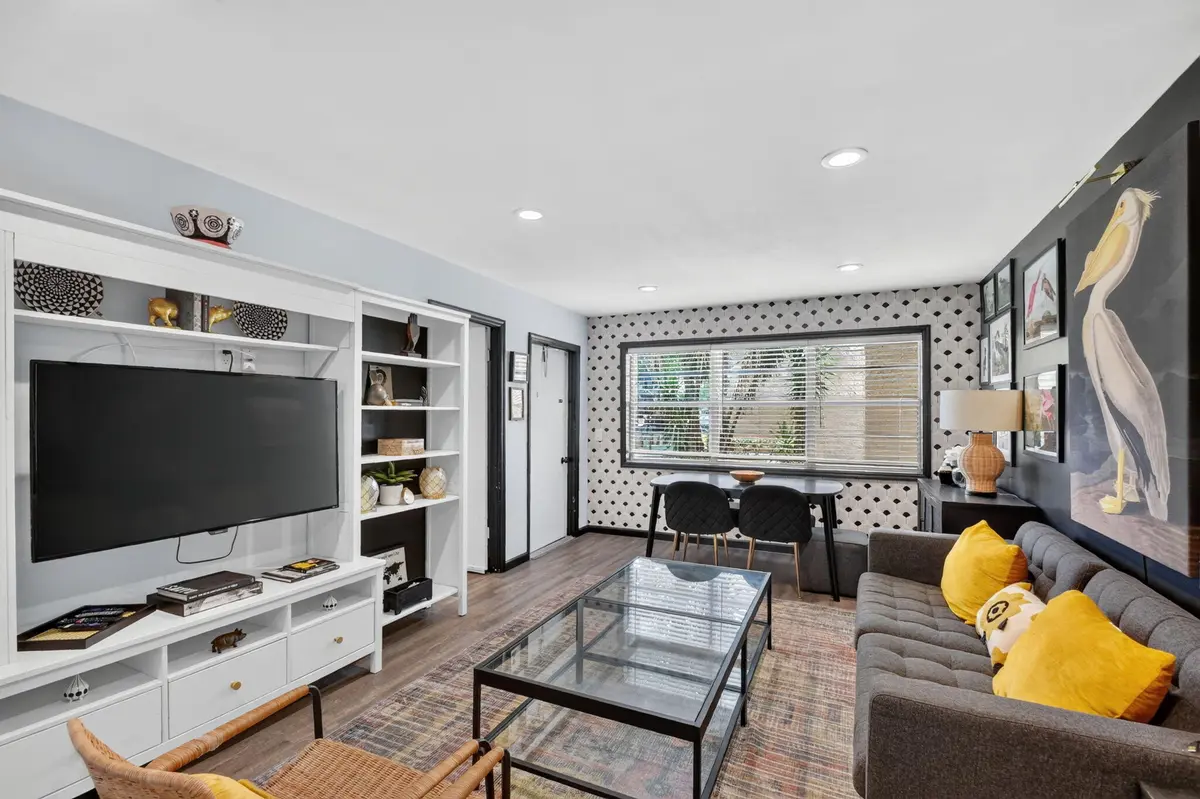Living 2 w/ wall unit and big screen TV at 124 Lake Evelyn Drive, West Palm Beach