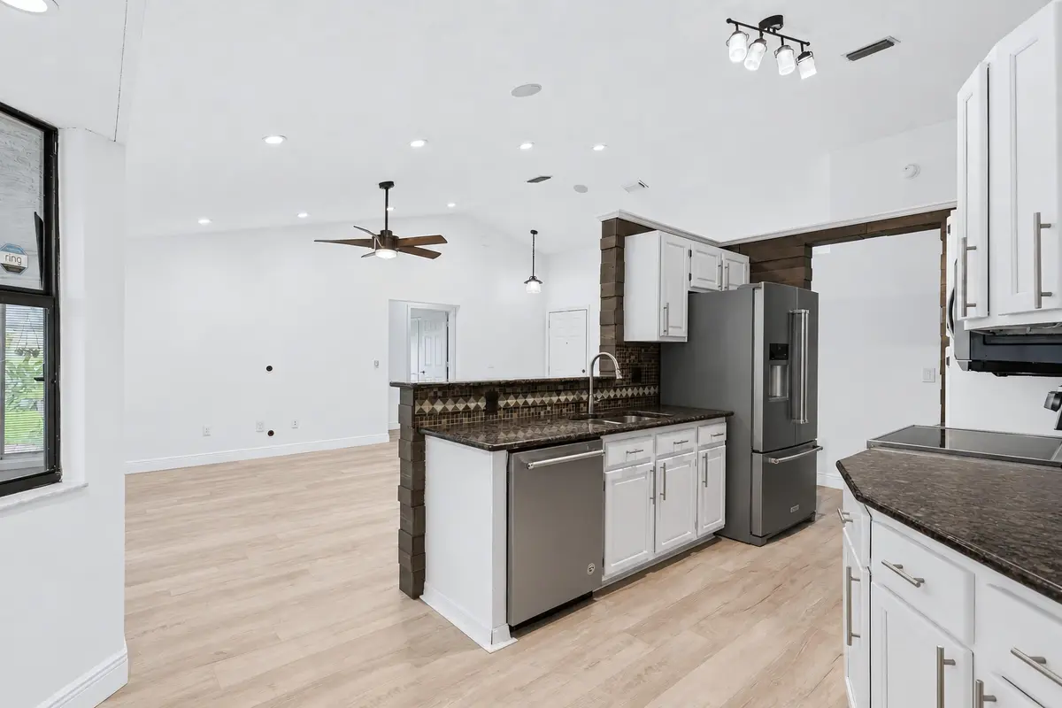 Open Kitchen + Living Room at 117 Sherwood Drive, Royal Palm Beach