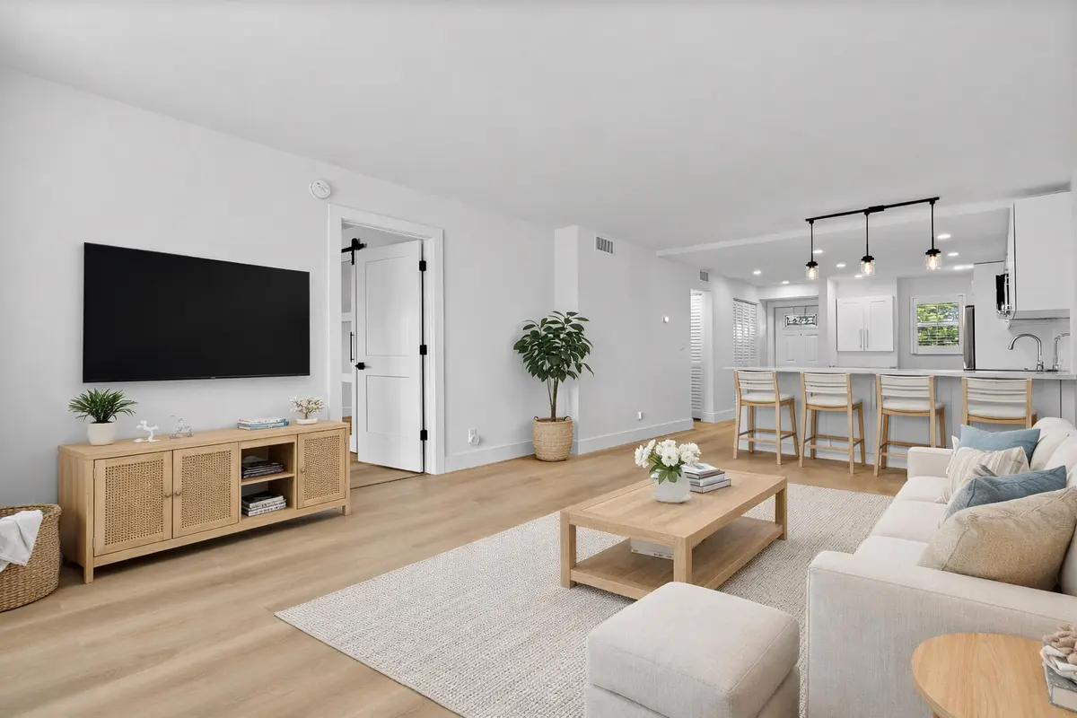 Staged living & kitchen at 750 NE Spanish River Boulevard 1090, Boca Raton