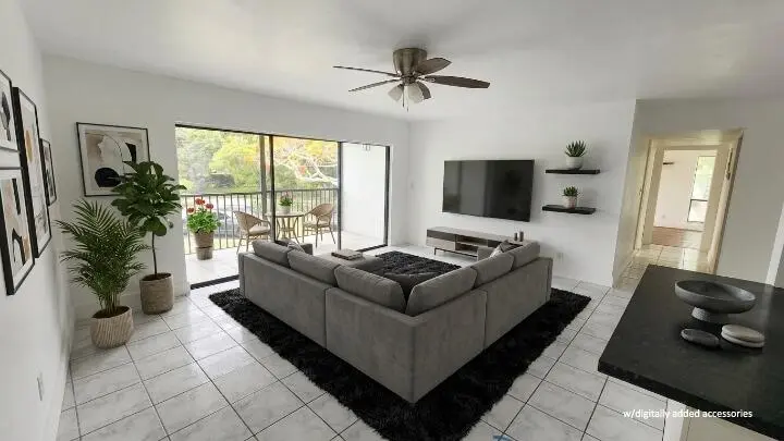 Living Room virtual staged at 517 Dotterel Road 31c, Delray Beach