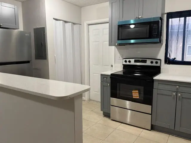 Door from kitchen to exterior at 322 SW 2nd Street 3, Pompano Beach