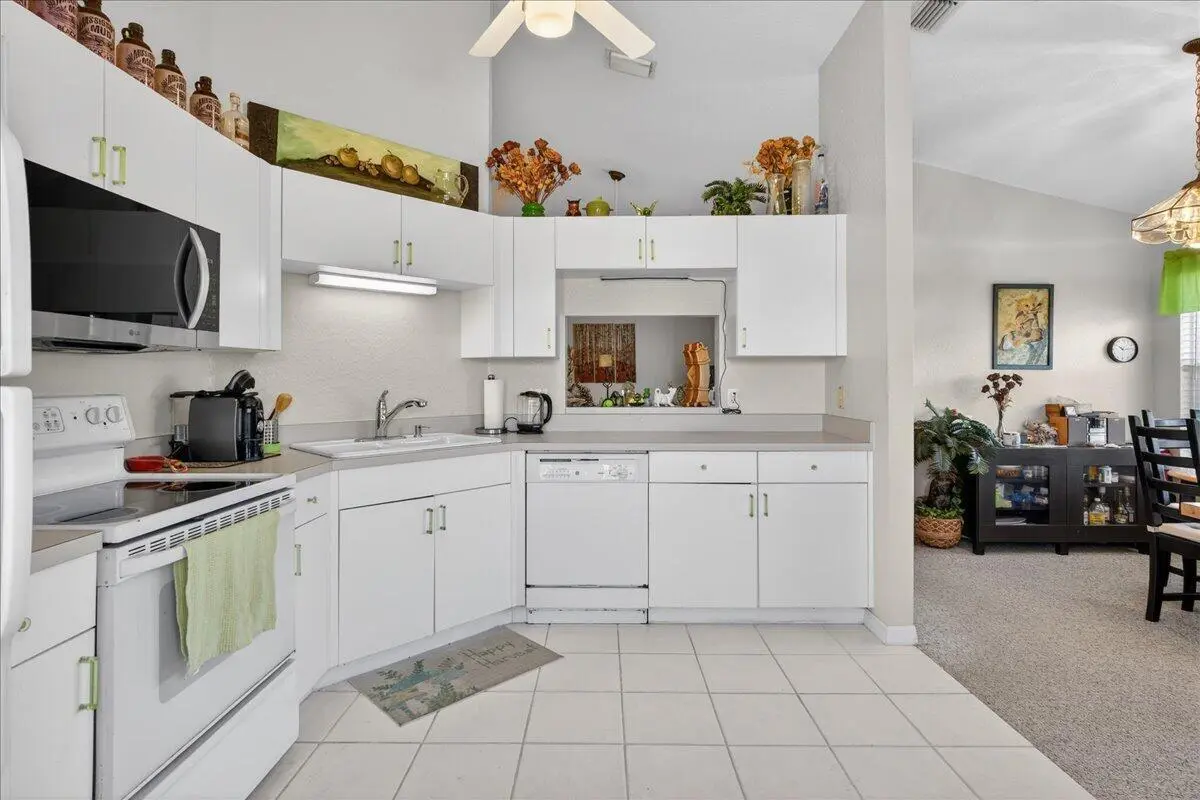 Kitchen to Dining Room at 1810 Waterford Drive 6, Vero Beach