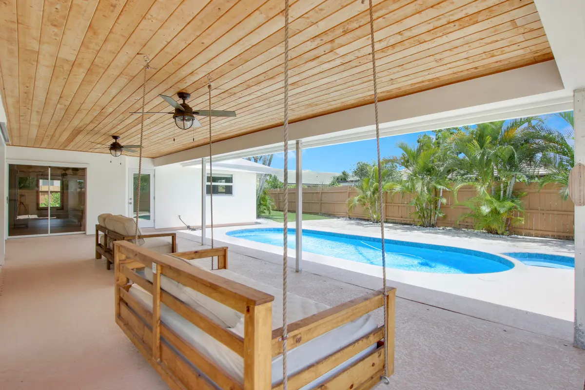 Covered back patio/pool at 30 Chestnut Trail, Tequesta