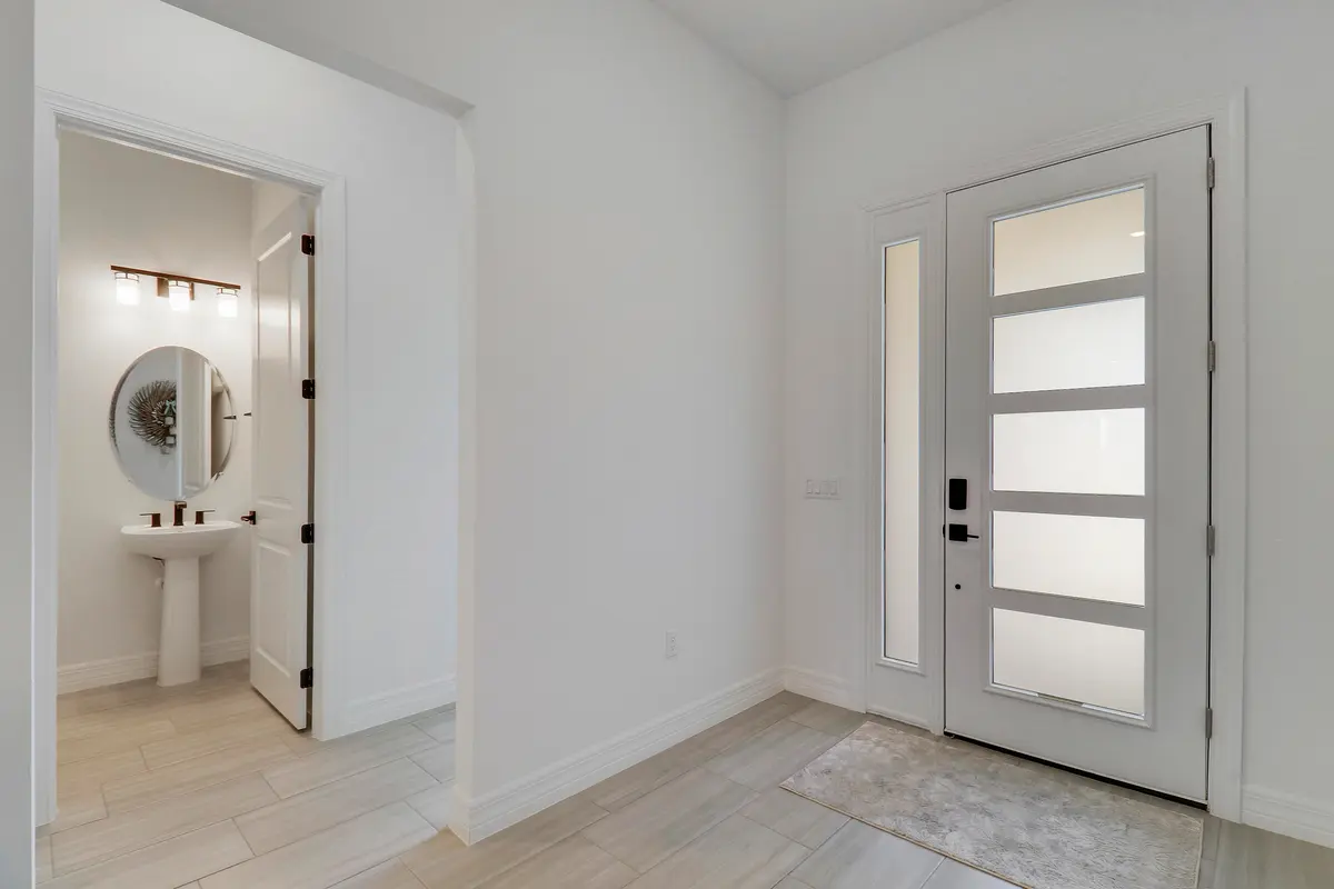 Foyer and half Bathroom at 10718 Stellar Circle, Palm Beach Gardens