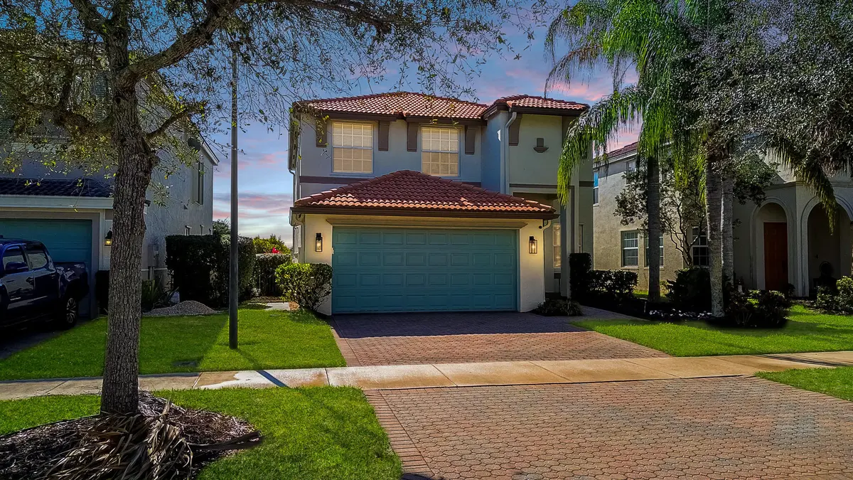 dusk front at 12017 SW Knightsbridge Lane, Port St. Lucie