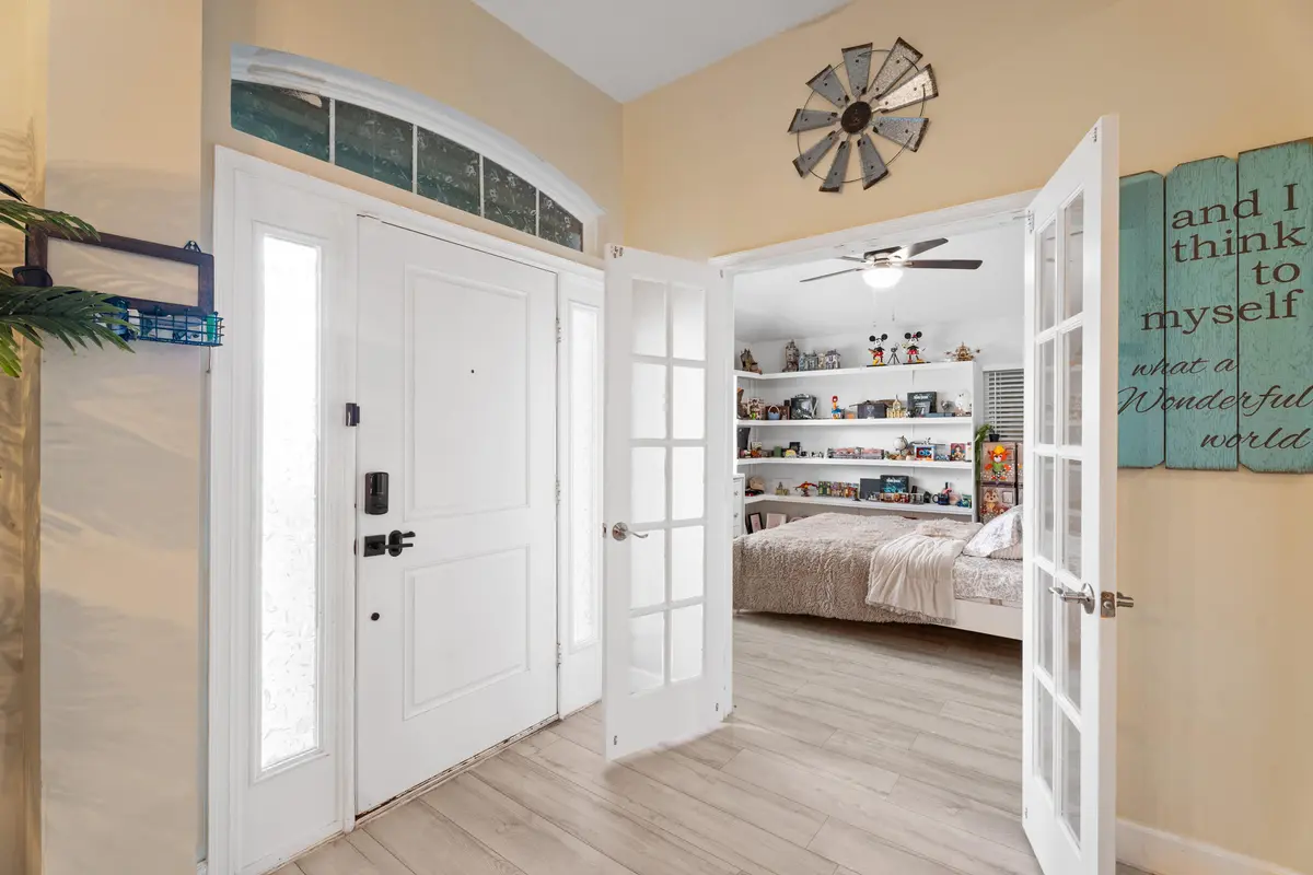 Front door and den at 5846 NW Dooley Circle, Port St. Lucie