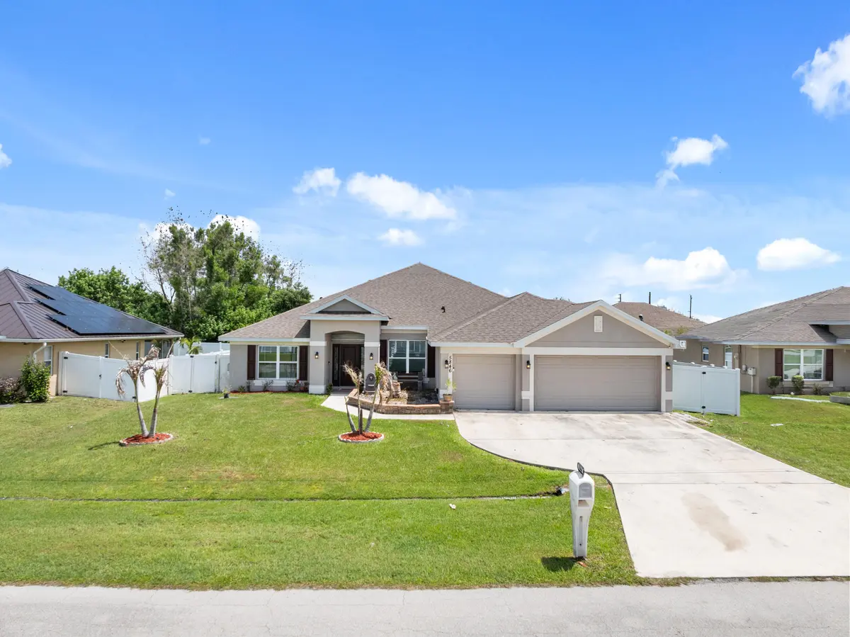 Front exterior at 5846 NW Dooley Circle, Port St. Lucie