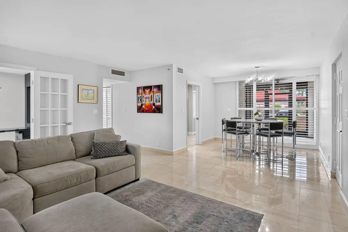 Living area and dining area at 7225 Promenade Drive 102, Boca Raton